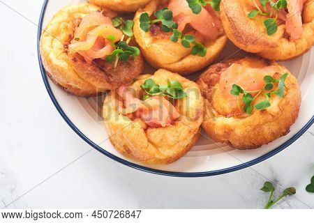 Yorkshire Pudding. Traditional English Yorkshire Pudding With Salmon And Radish Microgreens Side Dis
