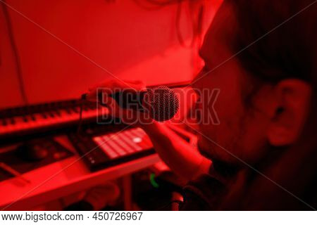 Partial Image Of Male Singer Singing Song In Microphone At Home Studio. Domestic Hobby, Entertainmen