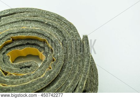 A Roll Of Felt Insulation. Self-adhesive Tape With Felt Insulation For Entrance Doors. Goods For Rep