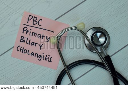 Pbc - Primary Biliary Cholangitis Write On Sticky Notes Isolated On Wooden Table. Medical Concept