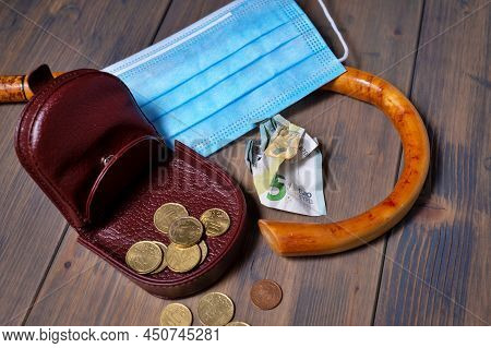 Conceptual Covid-19 Flat Lay Still Life With Money Spilling From An Open Purse Onto A Wooden Table W