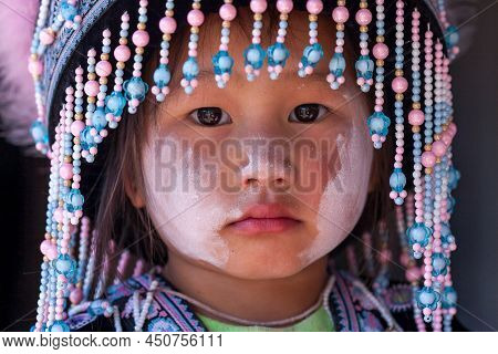 Nan, Thailand - December 22, 2011: Portrait Of A Little Hmong Tribe Girl In Traditional Clothing Dur