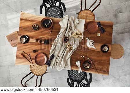 Stylish Interior Design Of Dining Room With Wooden Walnut Table, Retro Chairs, Tableware, Plates, Ta