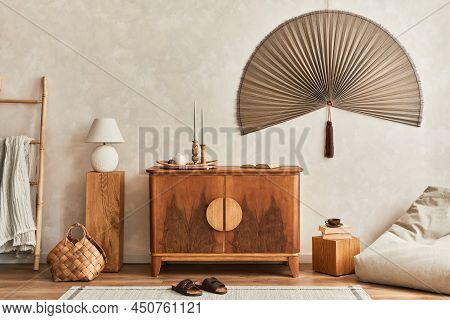 Japandi Concept Of Living Room Interior With Design Wooden Commode, Table Lamp, Tropical Dried Leaf
