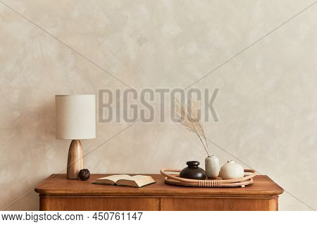 Minimalist Composition Of Living Room With Wooden Commode, Table Lamp, Dried Flower In Vase, Book, D