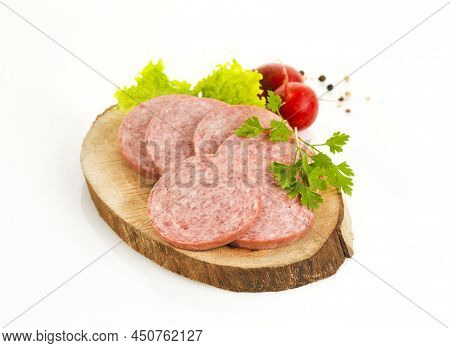 Slices Of Salami Made From Smoked Turkey Meat On A Wooden Board(horizontal)