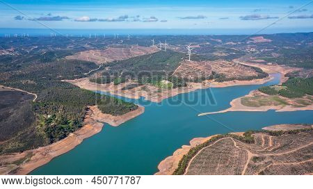 Aerial. Photo From Sky, Dams Filled With Water Bravura Portimao. In Background, A Park Of Wind Gener