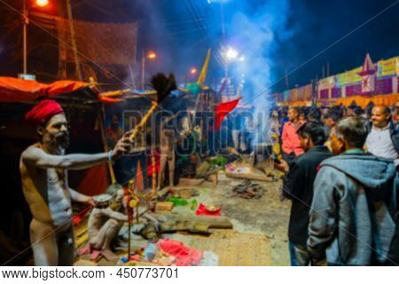 Blurred Image Of Hindu Sadhu Blessing Devotees At Gangasagar Transit Camp, Outtram Ghat. Huge Number
