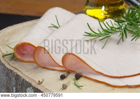Close Up Of Slices Of Boiled Turkey Filet On A Wooden Board(horizontal)