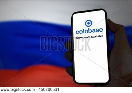 Moscow, Rus, March 2022: Hand Holding A Phone With The Coinbase App Out Of Service On Screen With Th