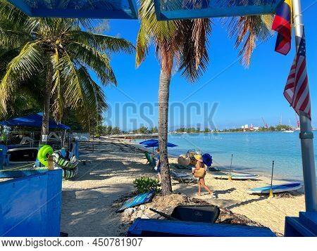 People Enjoying Junkanoo Beach In Nassau, Bahamas.