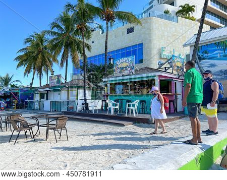 People Enjoying Junkanoo Beach In Nassau, Bahamas.
