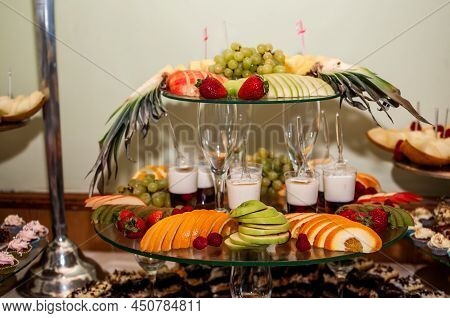 Fruit Slicing At A Wedding Banquet. Watermelon, Grapes, Strawberry, Orange, Plum, Pear, Dinha, Peach