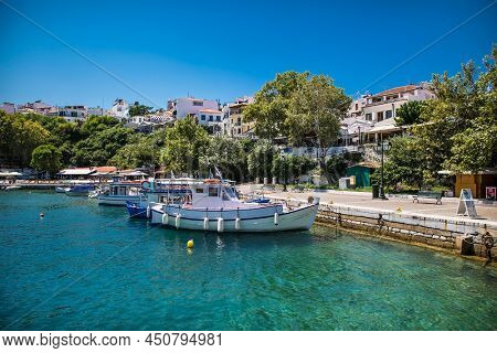 Skiathos, Greece- Avg 10, 2019. Traditional fisher boat anchored in the old harbour on Skiathos Island ,Greece.