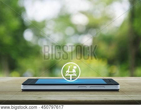 Service Fix Motorcycle With Wrench Tool Flat Icon On Modern Smart Mobile Phone Screen On Wooden Tabl