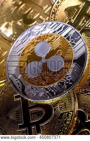 Ripple Xrp Coin On Bitcoins Background, Cryptocurrency Investing Concept