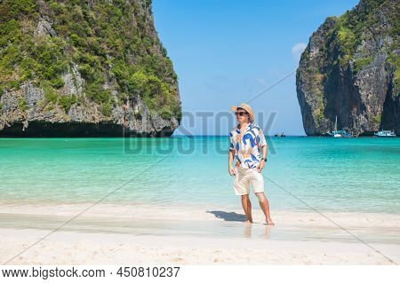 Happy Tourist Man At Maya Bay Beach On Phi Phi Island, Krabi, Thailand. Landmark, Destination Southe
