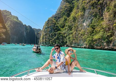 Couple Tourist On Boat Trip, Happy Traveller Relaxing At Pileh Lagoon On Phi Phi Island, Krabi, Thai