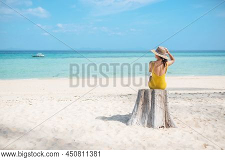 Woman Tourist In Yellow Swimsuit And Hat, Solo Traveller Looking Beautiful Sea View At Bamboo Island