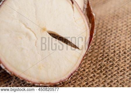 Yucca Cassava Sliced Root Close Up On Rustic Rough Burlap. Macro