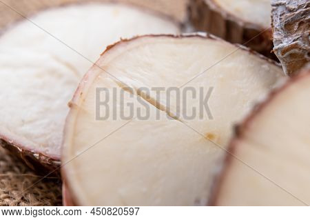 Yucca Cassava Sliced Root Close Up On Rustic Rough Burlap. Macro