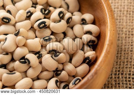 Traditional Castilla Beans. Dry Spanish Legumes Falling In Rustic Wooden Bowl. Beige Grains. Black E
