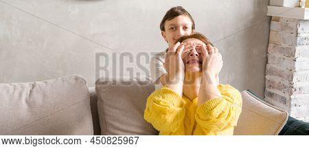 Son Closing His Mother Eyes With His Hands.happy Family.prepapring Surprise