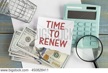 Office Desk Table With Paper Sheet, Notepad ,chart And Calculator. Top View Text Time To Renew.
