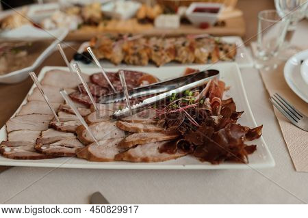 Slicing Different Types Of Meat. Meat Snacks On The Table. Wedding Buffet. Catering