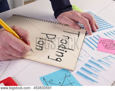 Trading Plan Is Shown On A Photo Using The Text