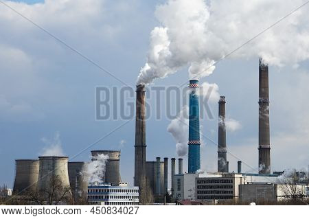 Bucharest, Romania - March 10, 2022: The Chimneys Of The Cet Sud Power Plant, Which Pollute With Smo