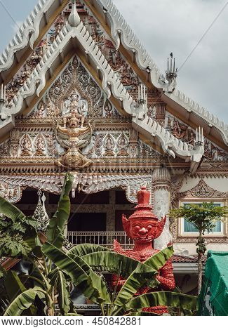 Stucco Figure The Red Giant Standing Guardian At The Entrance Of The Ordination Hall In Wat Khlong P