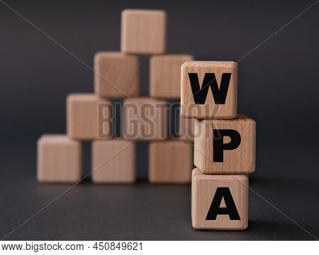 Wpa (works Progress Administration) - Acronym On Wooden Cubes On A Dark Background. Internet Concept