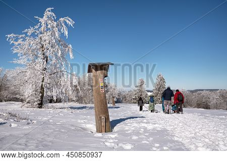 Winterberg, Germany - February 13, 2021: Hiking Trail During Winter With Focus On The Waymark On Feb