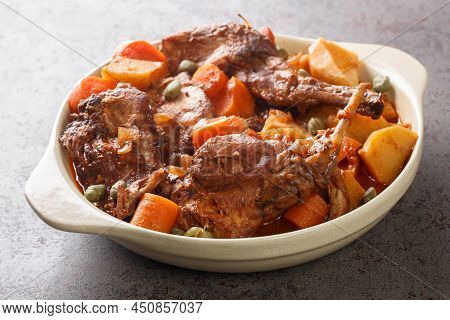 Rabbit Stew Maltese Style Or Stuffat Tal-fenek Closeup In The Pan On The Table. Horizontal