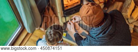 Banner, Long Format Dad And Son Spend Time By The Fireplace In Glamping. Rest In The Mountains In Gl