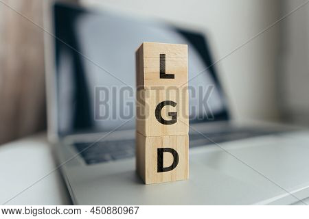 Concept Loss Given Default Or Lgd. Business Acronym. Cubes With Letters On A Laptop