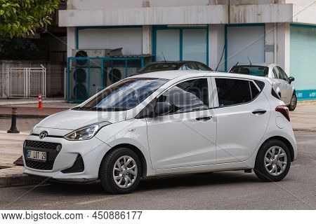 Side, Turkey -february  20, 2022:  White   Hyundai I10  Is Parking  On The Street On A  Summer Day A