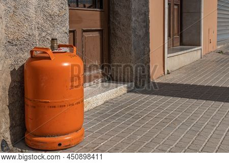 Felanitx, Spain; March 07 2022: Empty Butane Canister At The Door Of A House, Waiting For The Butane
