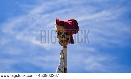 Skull On A Stick With Cap. Taken At A Medieval Festival. Eerily Beautiful The Smile