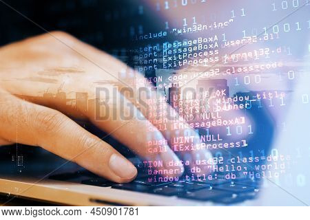 Close Up Of Male Student Hand Using Laptop Keyboard With Abstract Html Code On Creative City Backgro