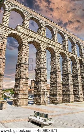 Architecture And Stone Arches Of The Millenary Roman Aqueduct In The City Of Segovia, Spain
