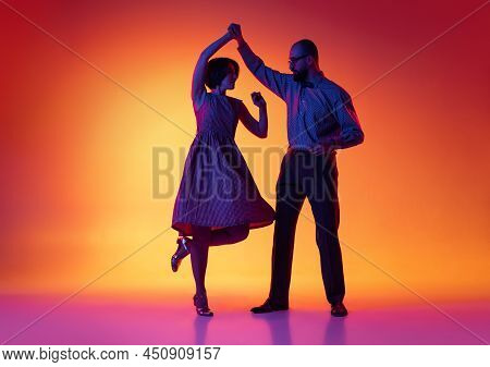 Portrait Of Excited Man And Woman, Couple Of Dancers In Vintage Retro Style Outfits Dancing Lindy Ho