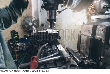 Selective Focus On Milling Machine. Blurred Worker Is Working On Milling Machine To Milling Metal Pl