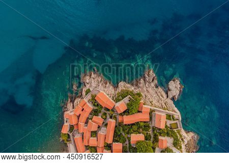 Aerophotography. View From Flying Drone. Panoramic View Of Sveti Stefan Island In Budva In A Beautif
