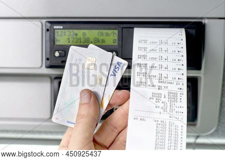 Olomouc Czech Rep Jan 7th 2021 Hand Holding A Driver Digital Card, Bank Debit Card Infront Of A Digi