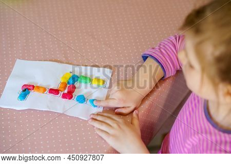 Little Creative Toddler Girl Making Colorful Giraffe With Playmais. Active Happy Child Having Fun Wi