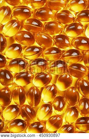 Golden Capsules Of Vitamin Omega 3 Fish Oil Close-up