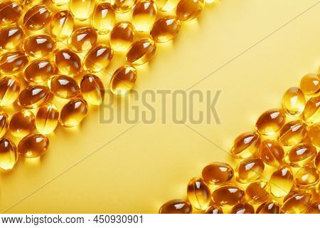Capsules In A Shell With Liquid Vitamin D3 On A Yellow Background And A Place For Text