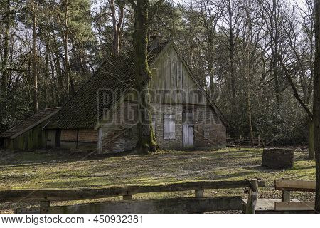 Old Farm In The Netherlands Near Burse In The Nature Reserve Burserzand, With A Wooden Fence In The 